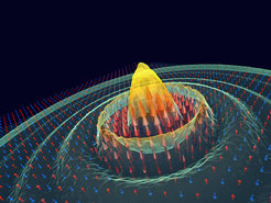 Darstellung des Antiferromagneten CoF2, der sich unter optischer Anregung in einen Ferrimagneten verwandelt. Die roten und blauen Pfeile kennzeichnen die ursprünglichen antiparallelen Drehungen. Terahertz-Lichtpulse induzieren Veränderungen in der Kristallstruktur, die die Spins polarisieren und einen neuen magnetischen Zustand erzeugen, der zur Informationsspeicherung und -verarbeitung genutzt werden kann.